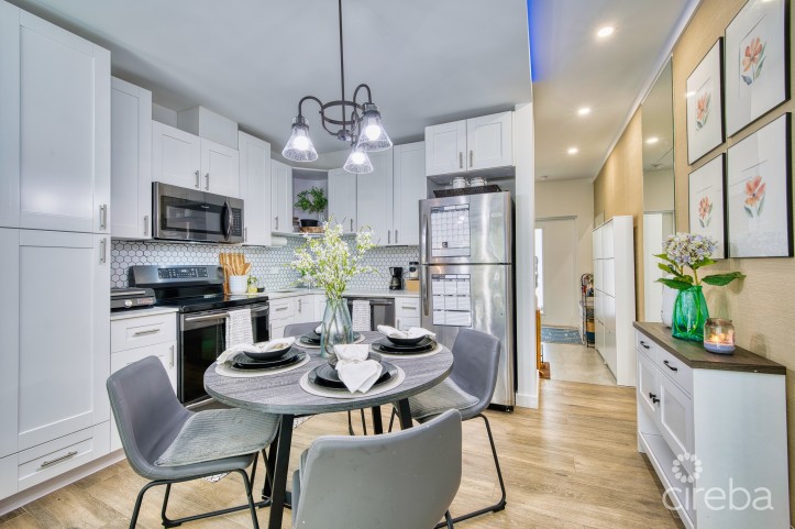 LIGHTHOUSE MANOR #6- CHIC 1-BEDROOM TOWNHOME IN GATED WEST BAY COMMUNITY