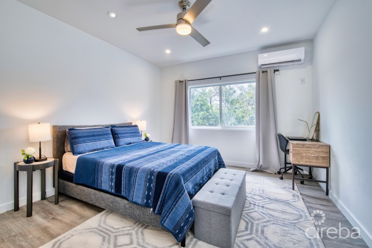 LIGHTHOUSE MANOR #6- CHIC 1-BEDROOM TOWNHOME IN GATED WEST BAY COMMUNITY